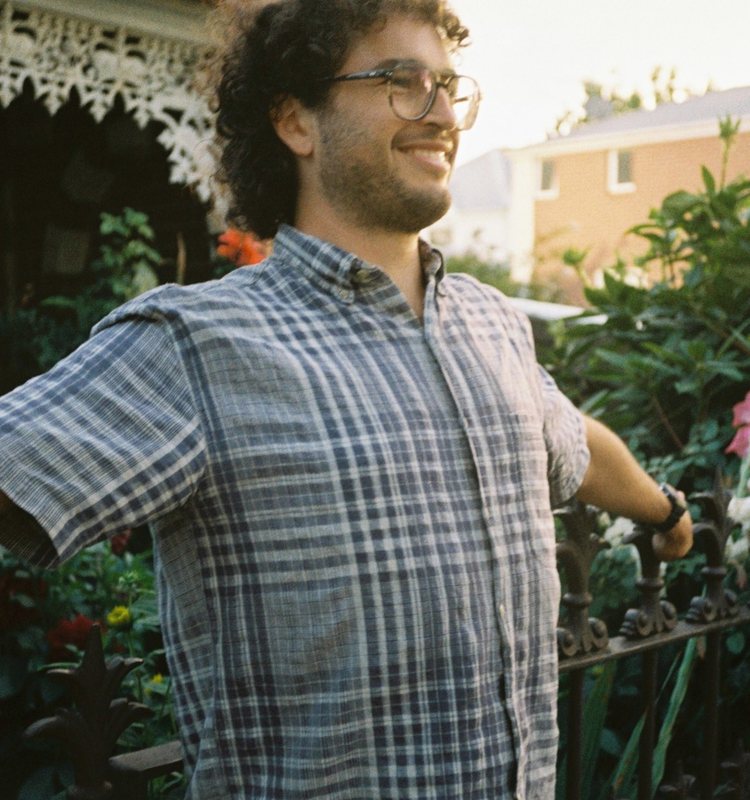 Matt Twort smiling in a Melbourne garden